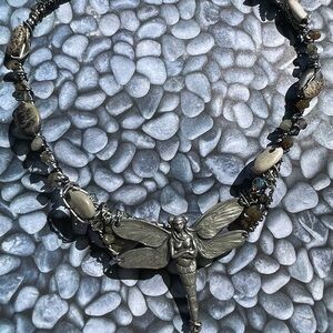 Handcrafted twisted wire choker necklace with large fairy charm.